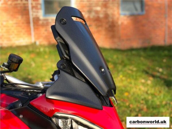 https://shared1.ad-lister.co.uk/UserImages/dccdce45-84a2-4984-a788-dd7d038e16de/Img/multistrada_v4_carbonworld/side-view-of-fitted-carbon-screen-to-ducati-multistrada-v4.jpg